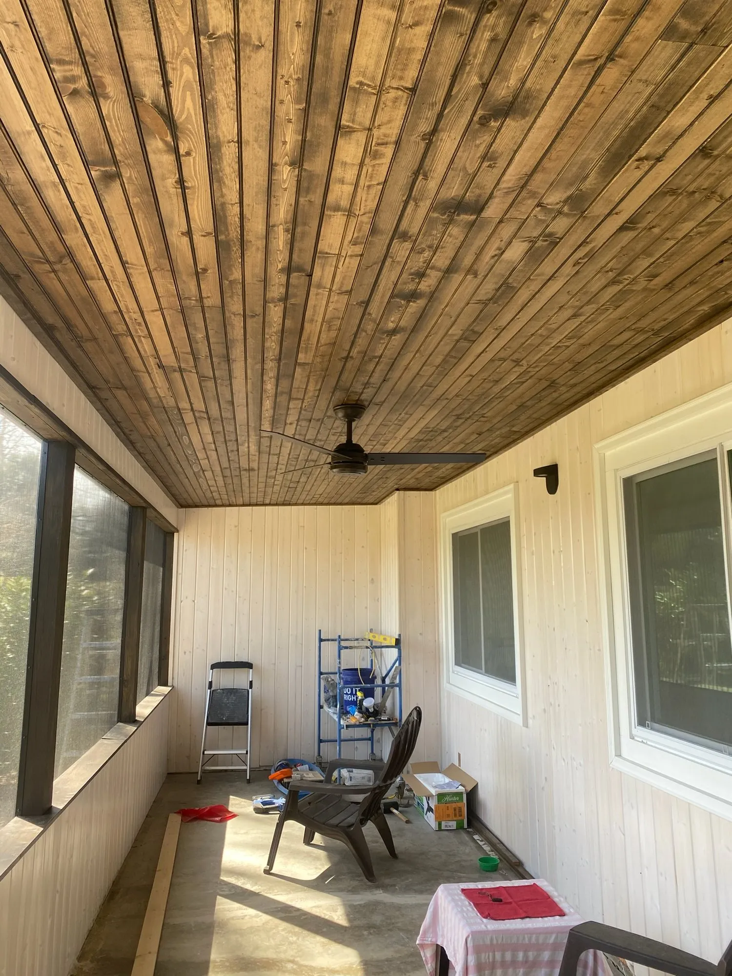 Porch with wood plank ceiling